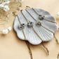 BRACELET MARGUERITES COQUILLEES