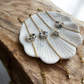 BRACELET MARGUERITES COQUILLEES